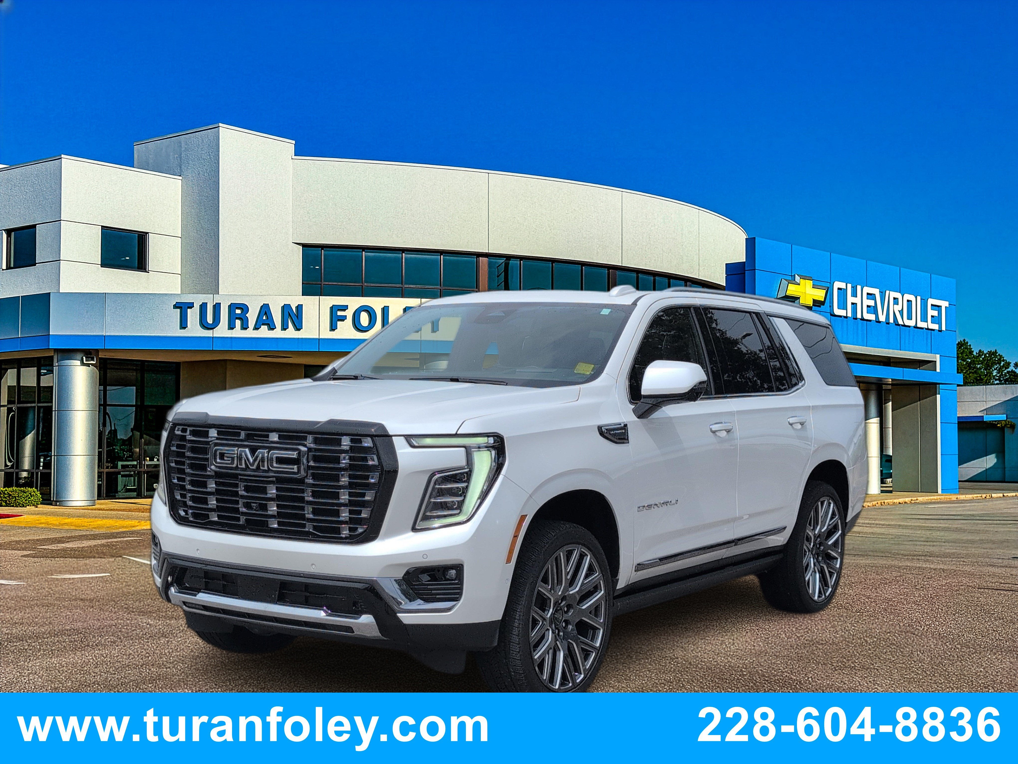 2025 GMC Yukon Denali Ultimate in White Frost Tricoat — front three-quarter view
